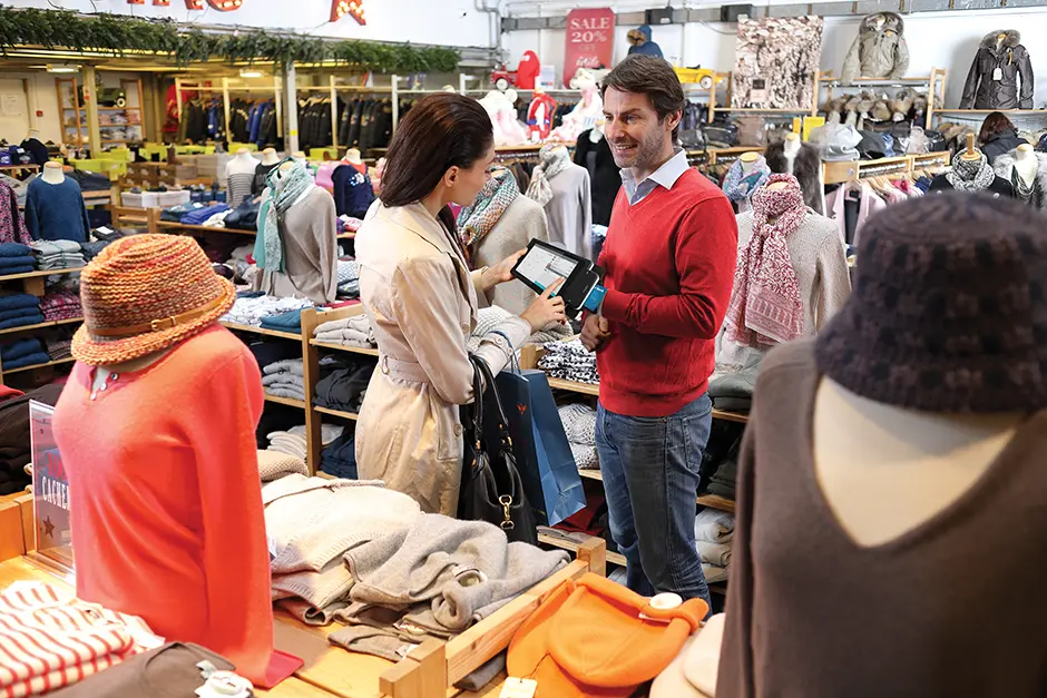 Shopper checking out using the Moby M70 terminal